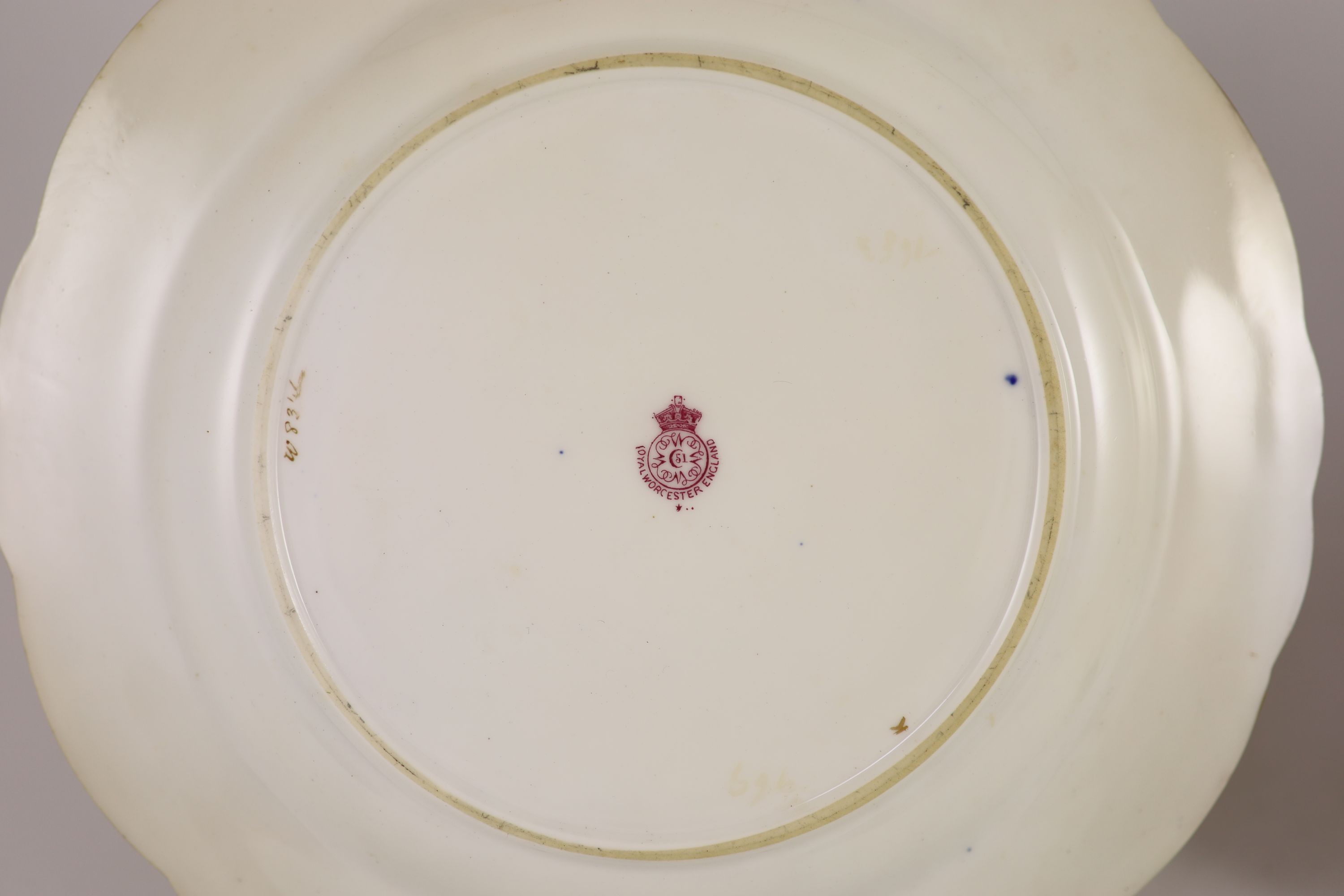 A pair of Royal Worcester fruit painted dessert plates, signed E. Phillips, c.1918, 22.5cm diameter